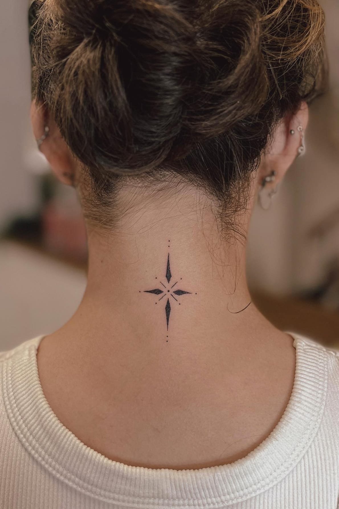 Small Star Tattoo on the Back of the Neck