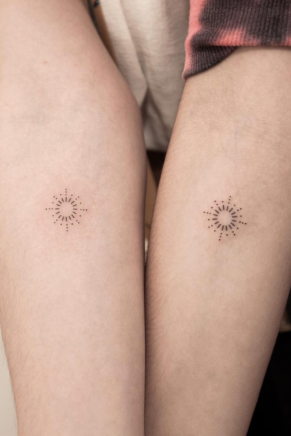 Small sun tattoo