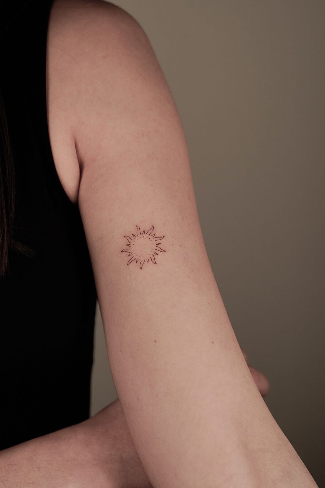 Small sun tattoo