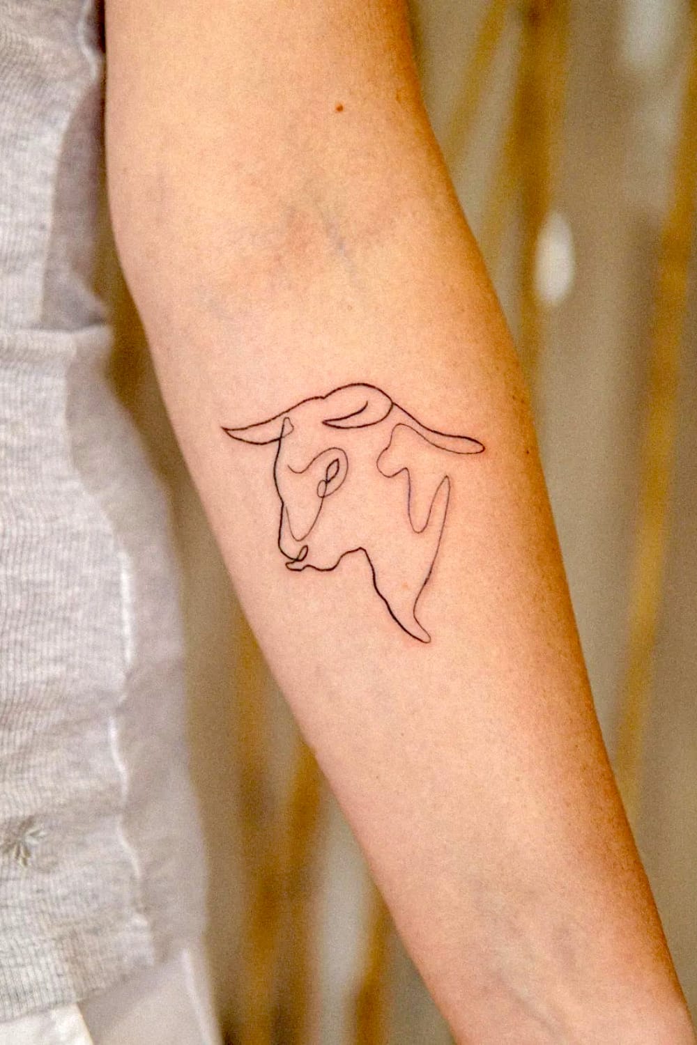Micro Abstract Taurus Tattoo