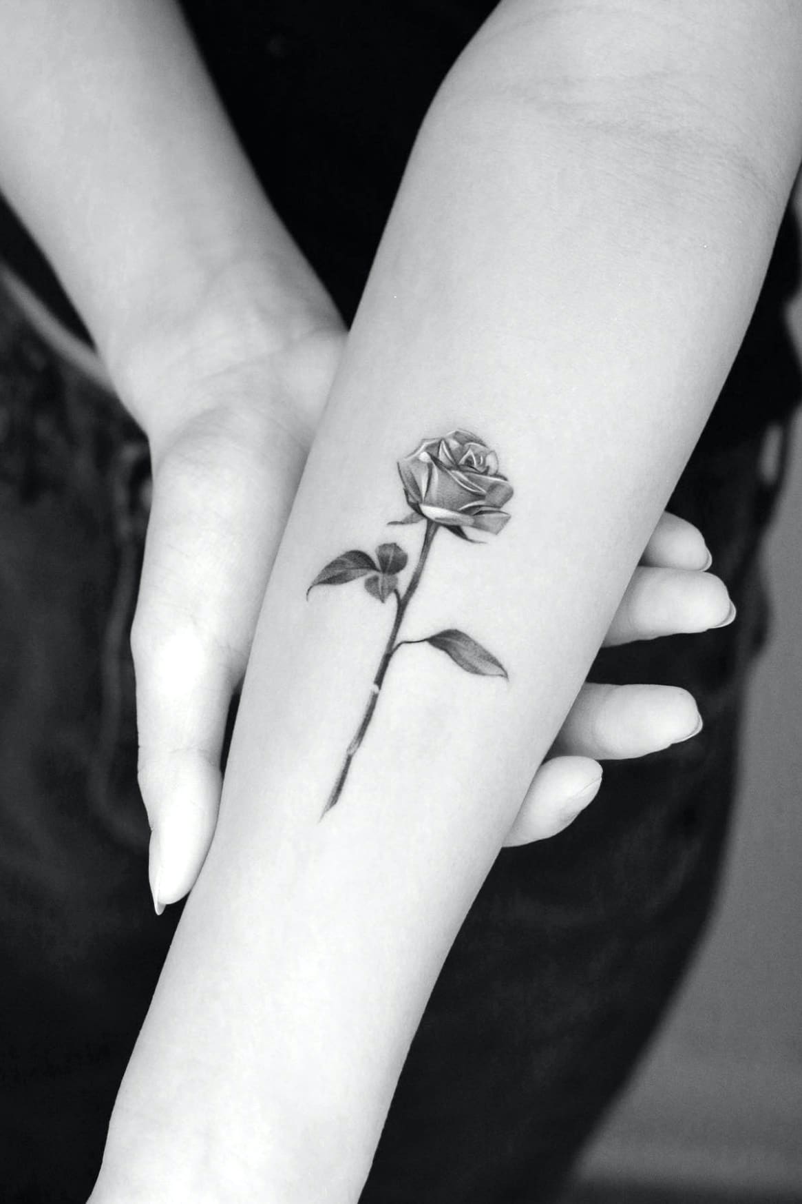 Small black and grey rose tattoo