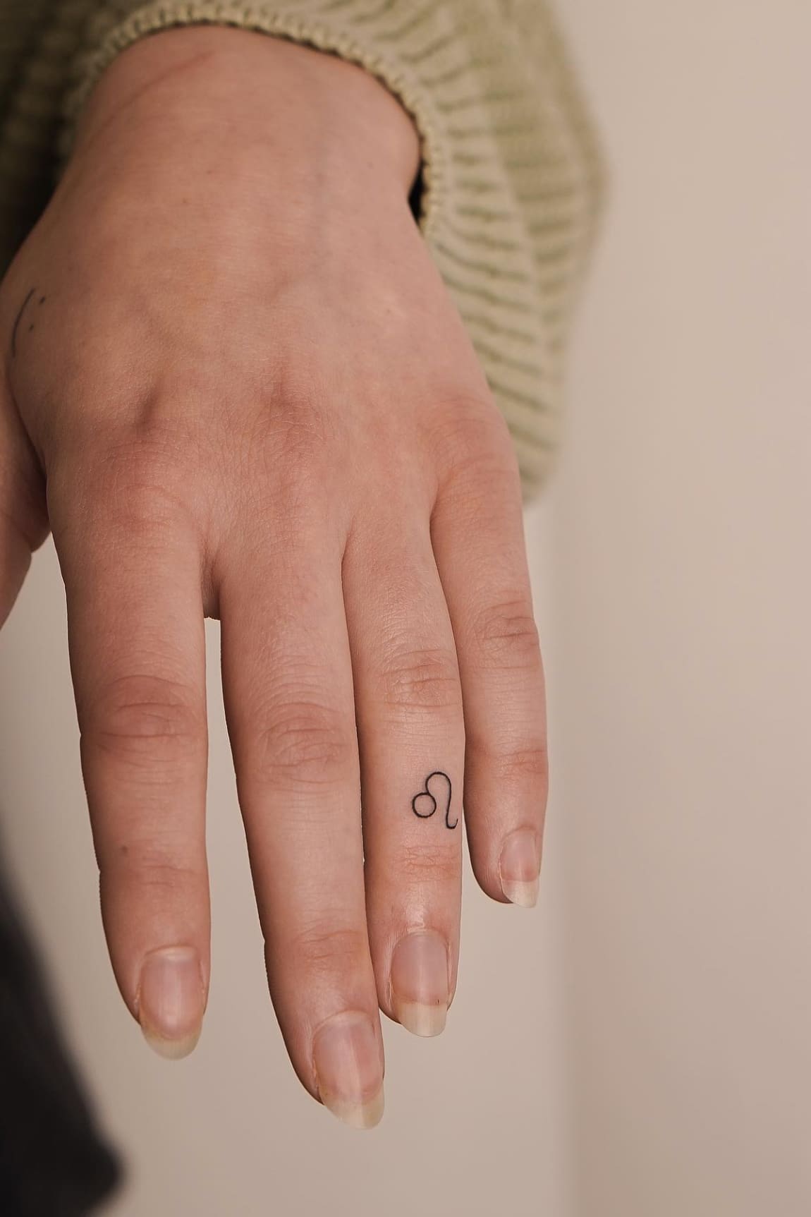 Leo Tattoo on Finger