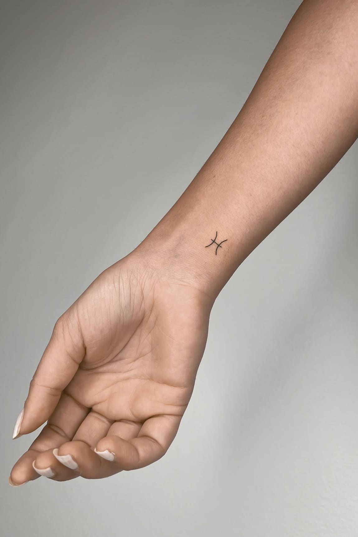 Minimal Pisces Tattoo