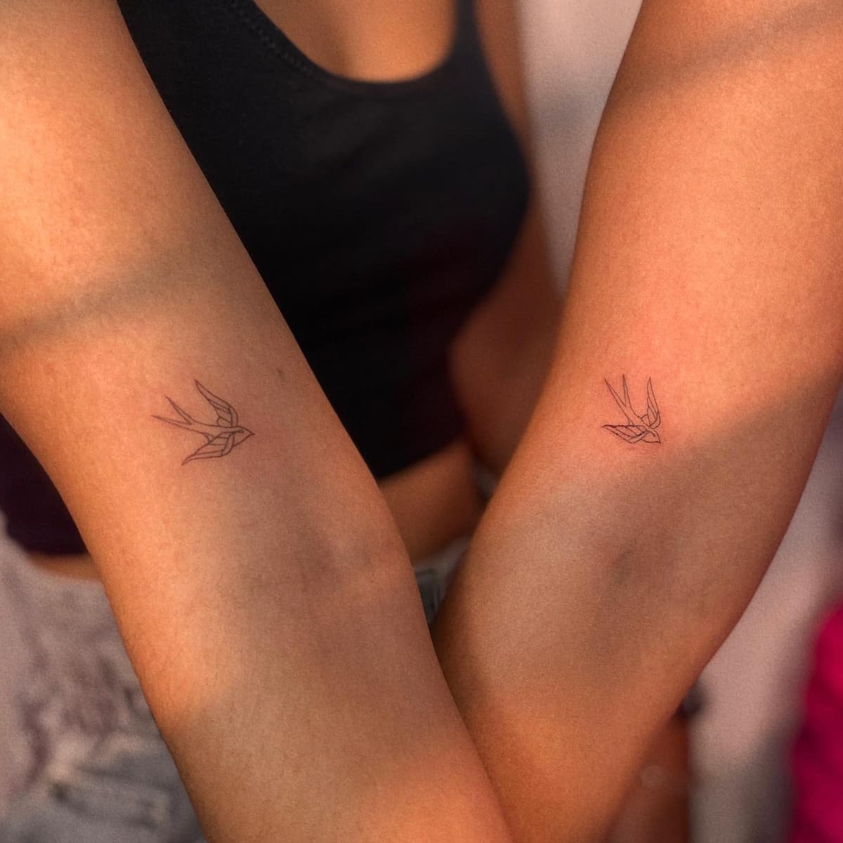 Swallow matching tattoo