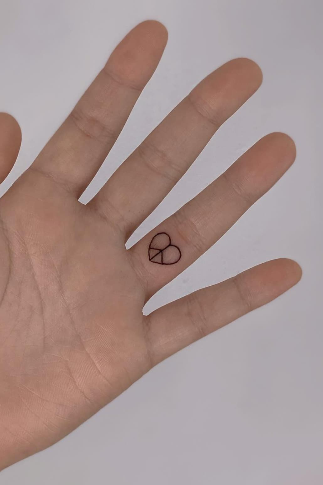 Small Peace Symbol tattoo