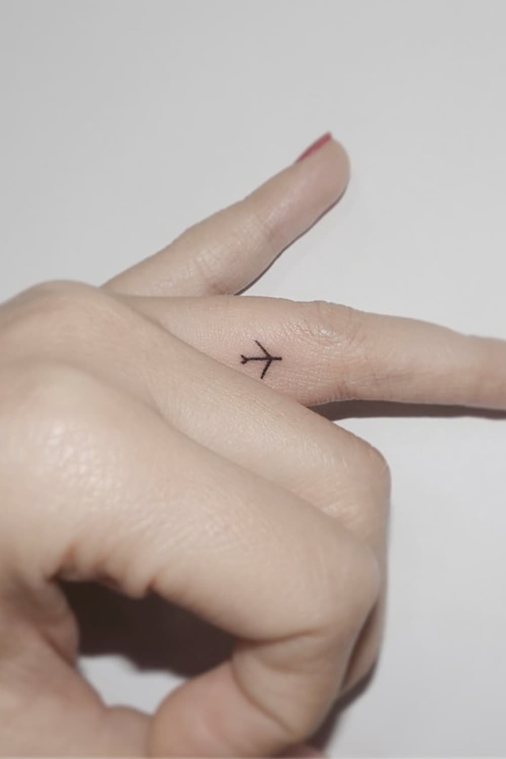 Tiny Airplane tattoo
