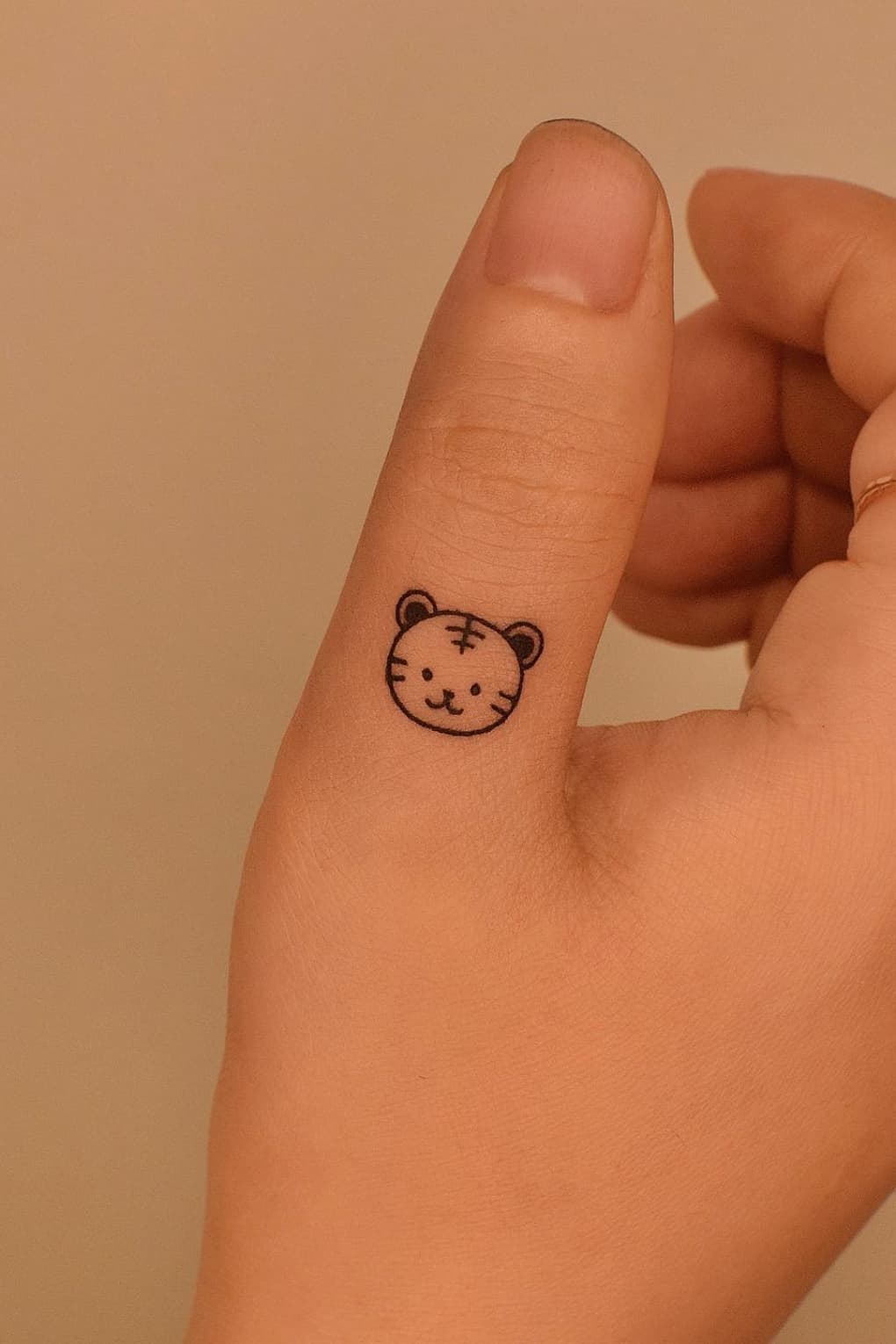 Cute Small Tiger head tattoo