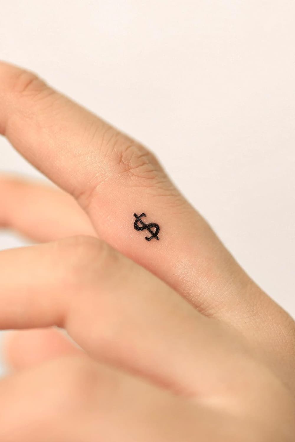 Small Dollar Sign Tattoo