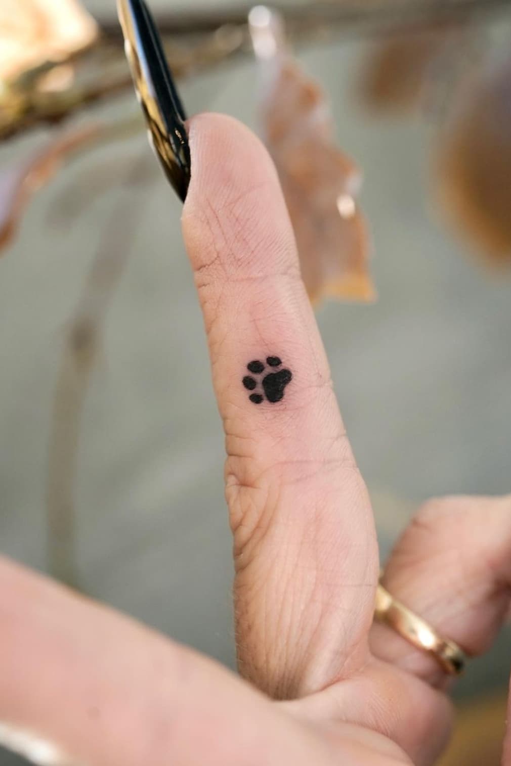 Black Small Paw Print Tattoo