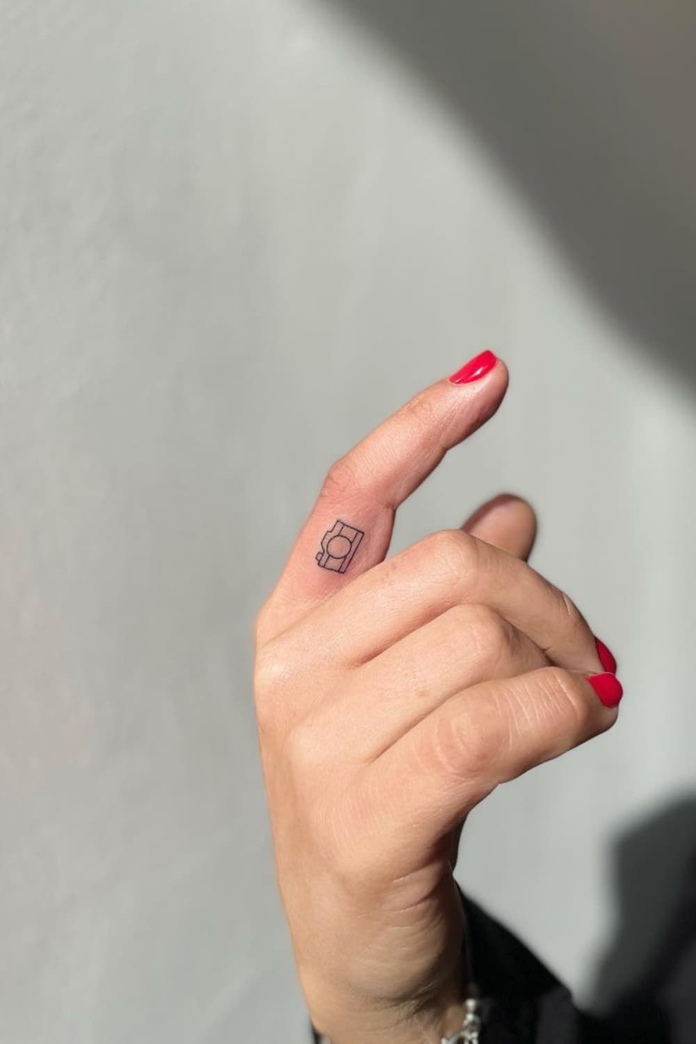 Small Fine Line Camera Tattoo