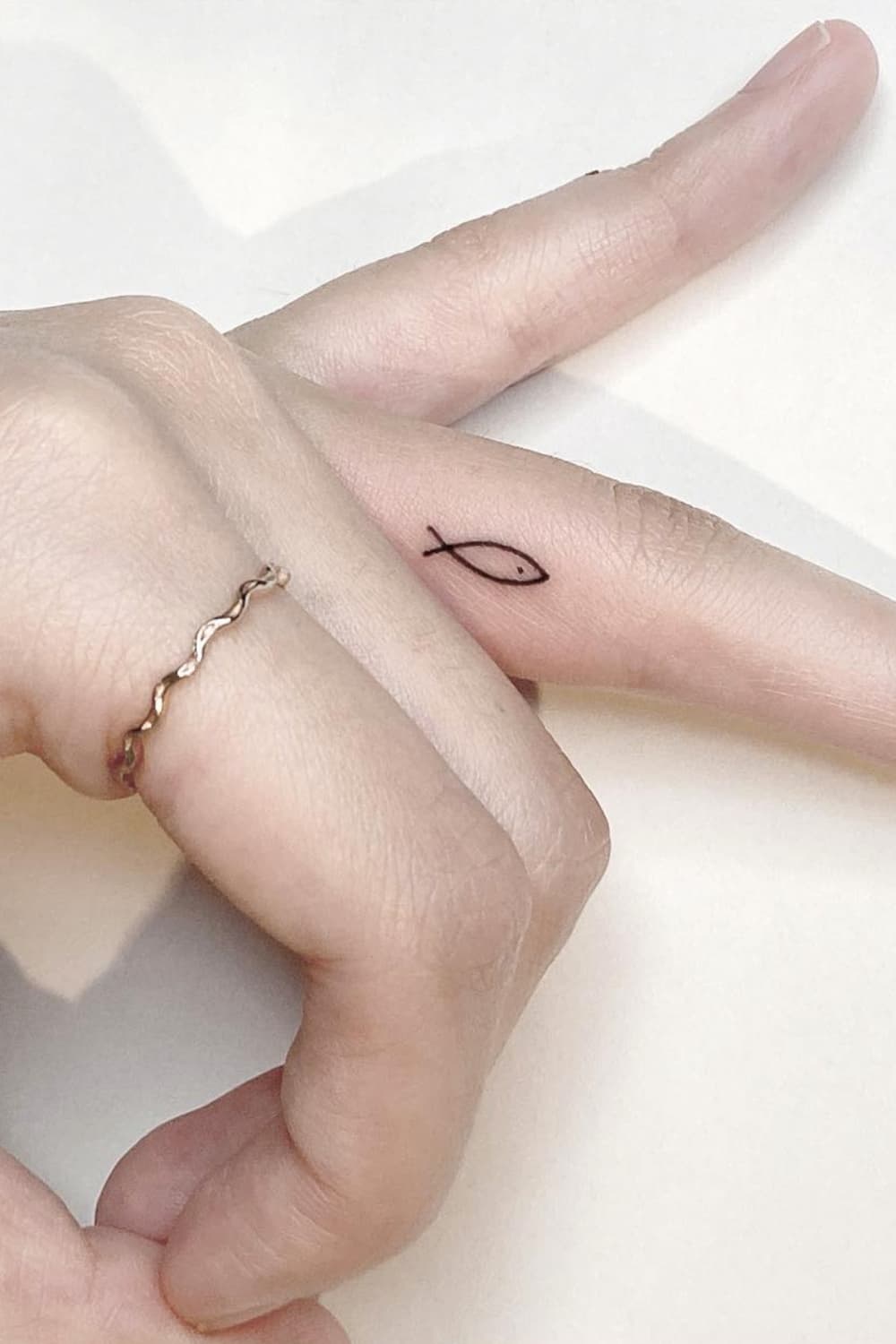 Minimalist Tiny Fish Tattoo