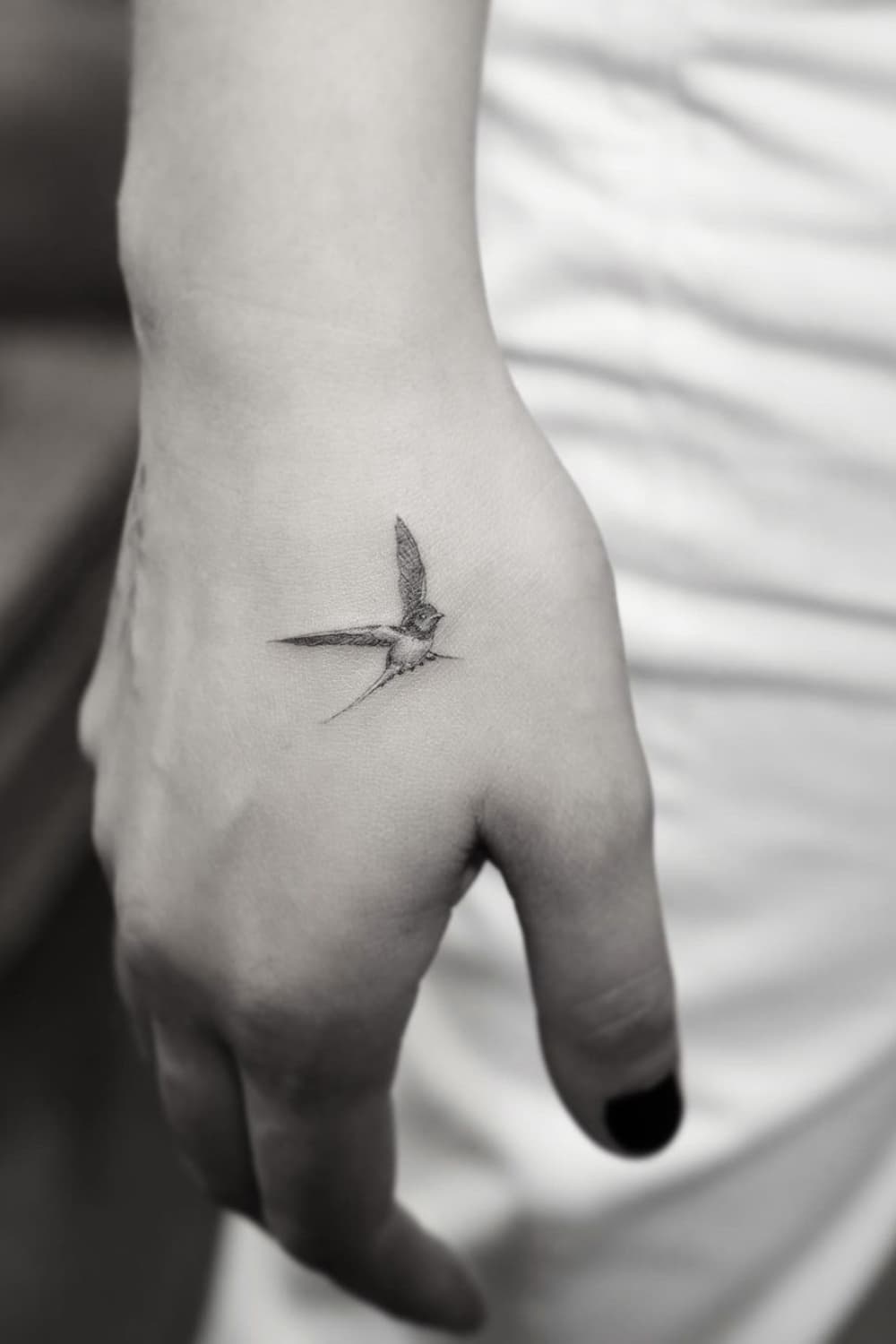Small Swallow Hand Tattoo