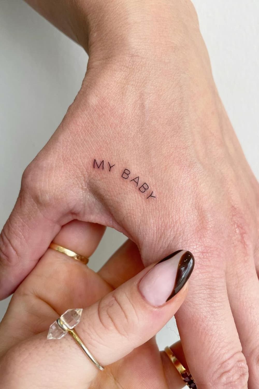 Small Text Hand Tattoo