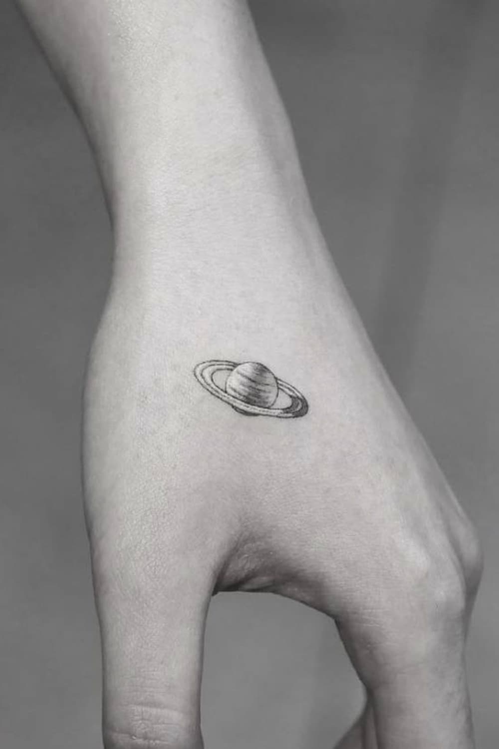 Small Planet Hand Tattoo