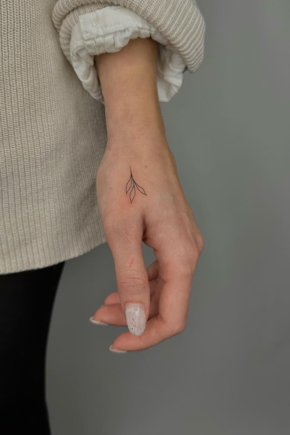 Small Plant Hand Tattoo