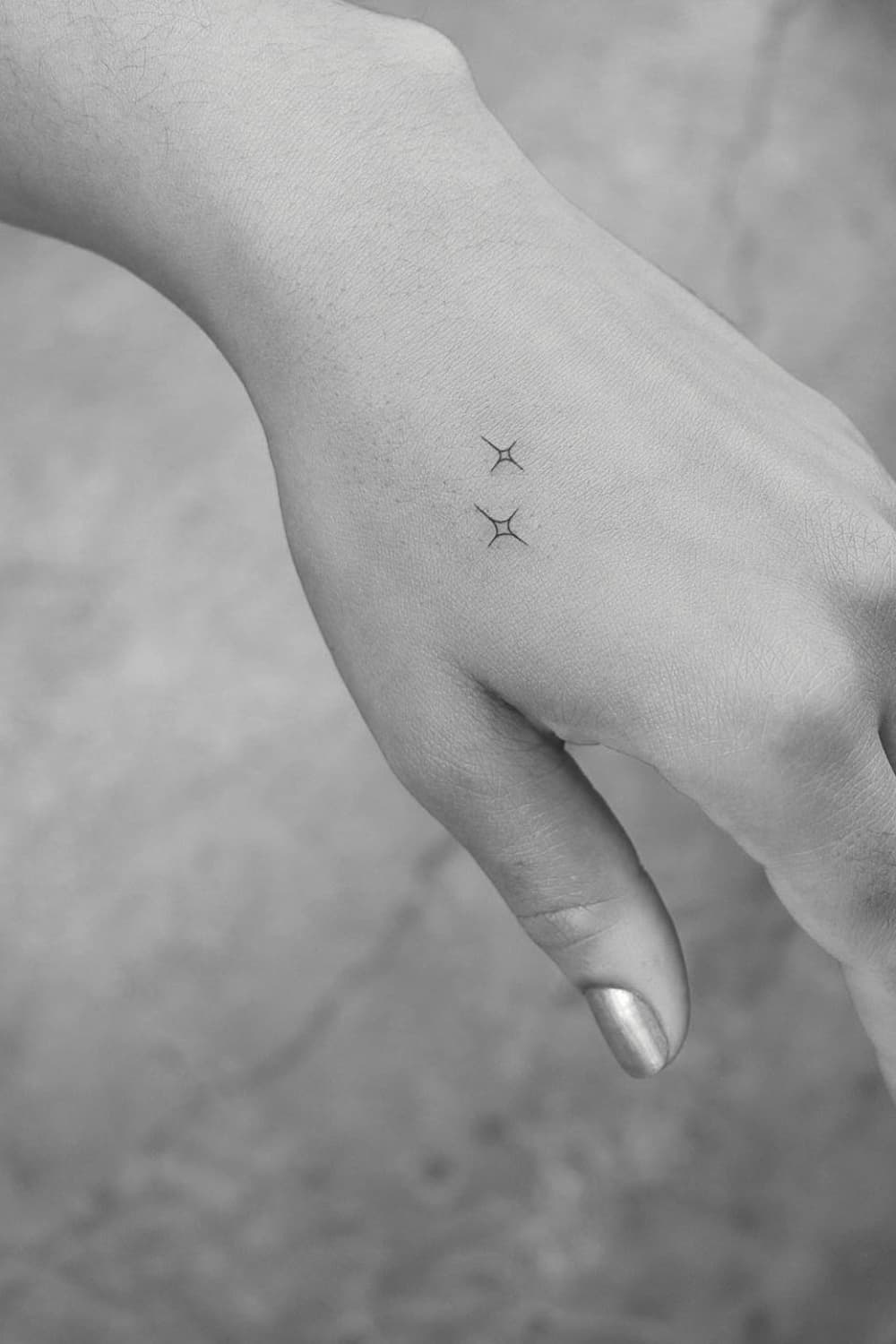 Small Star Hand Tattoo