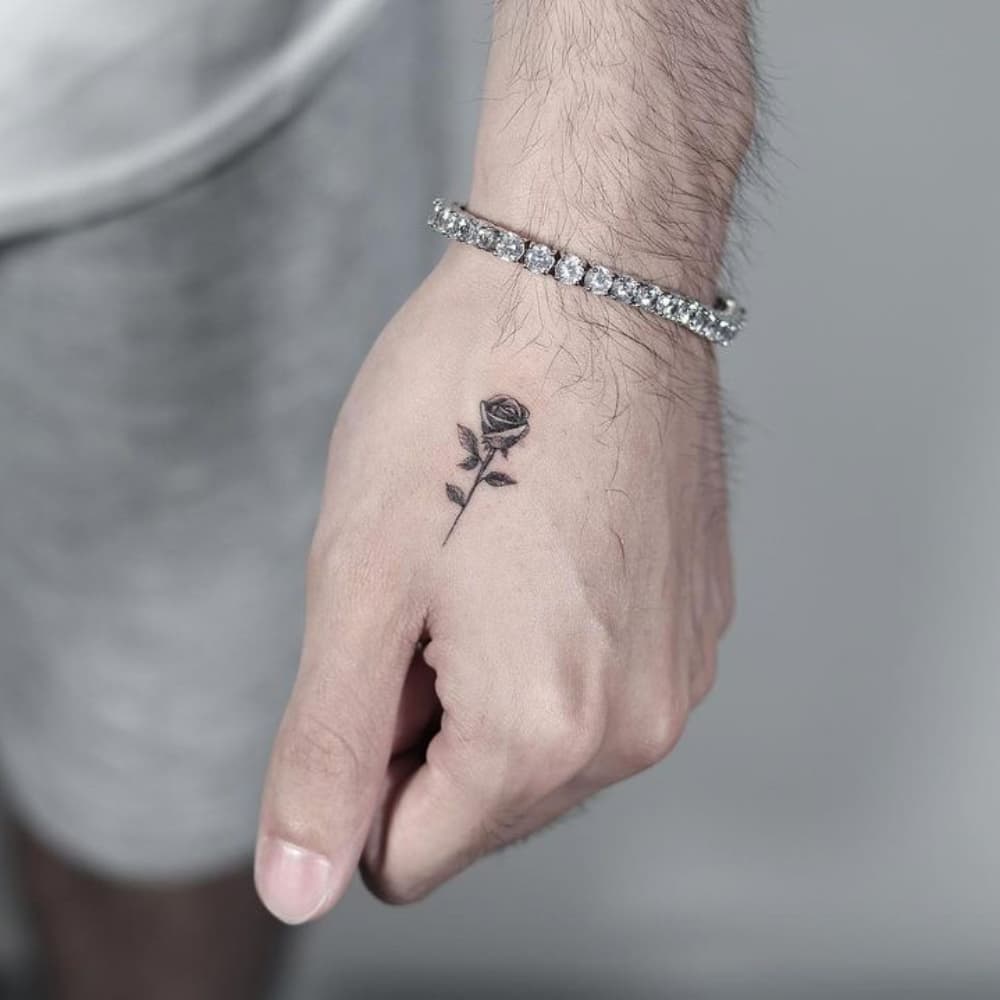 Small Rose Hand Tattoo