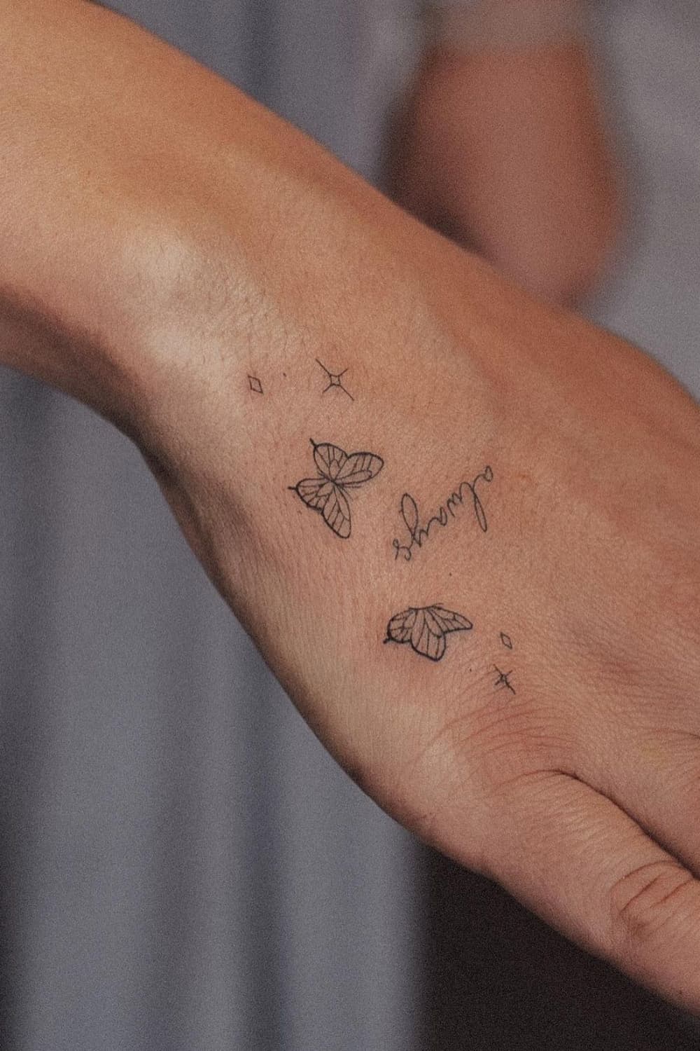 Small Butterfly Hand Tattoo