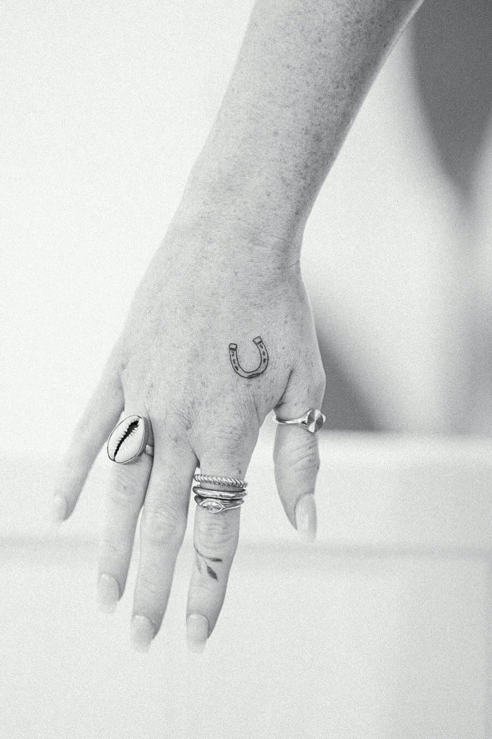 Small Horseshoe Hand Tattoo