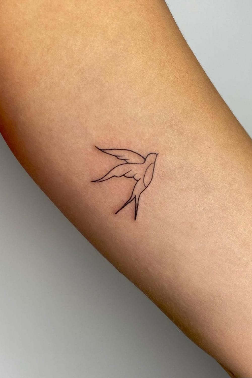 Minimalist Swallow Tattoo