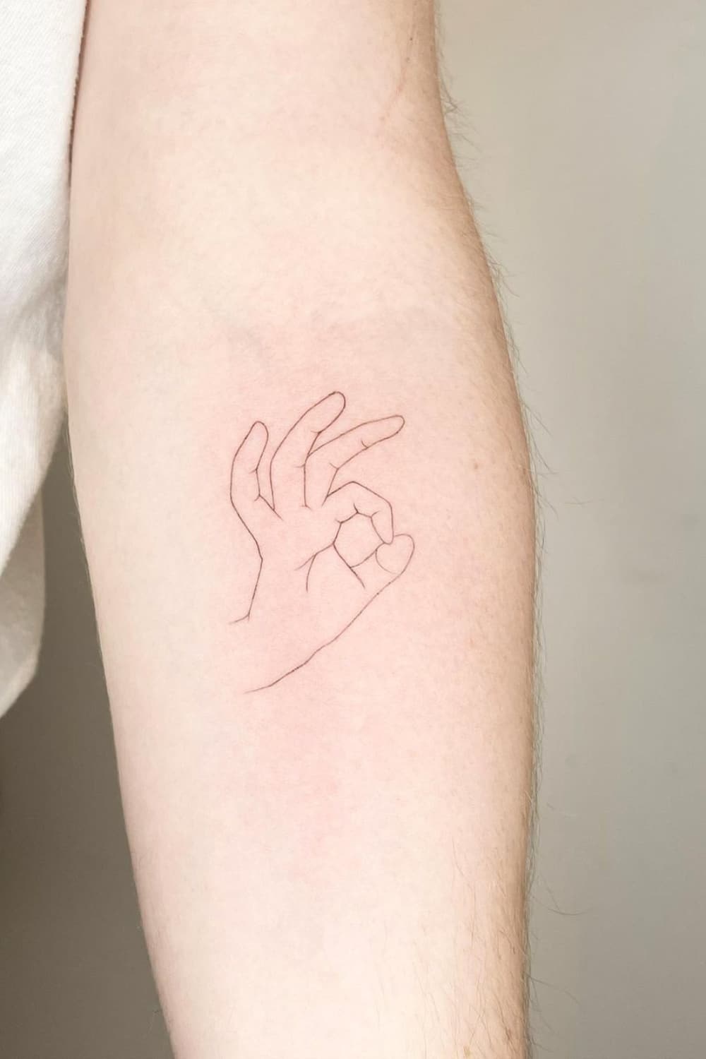 OK Gesture Tattoo