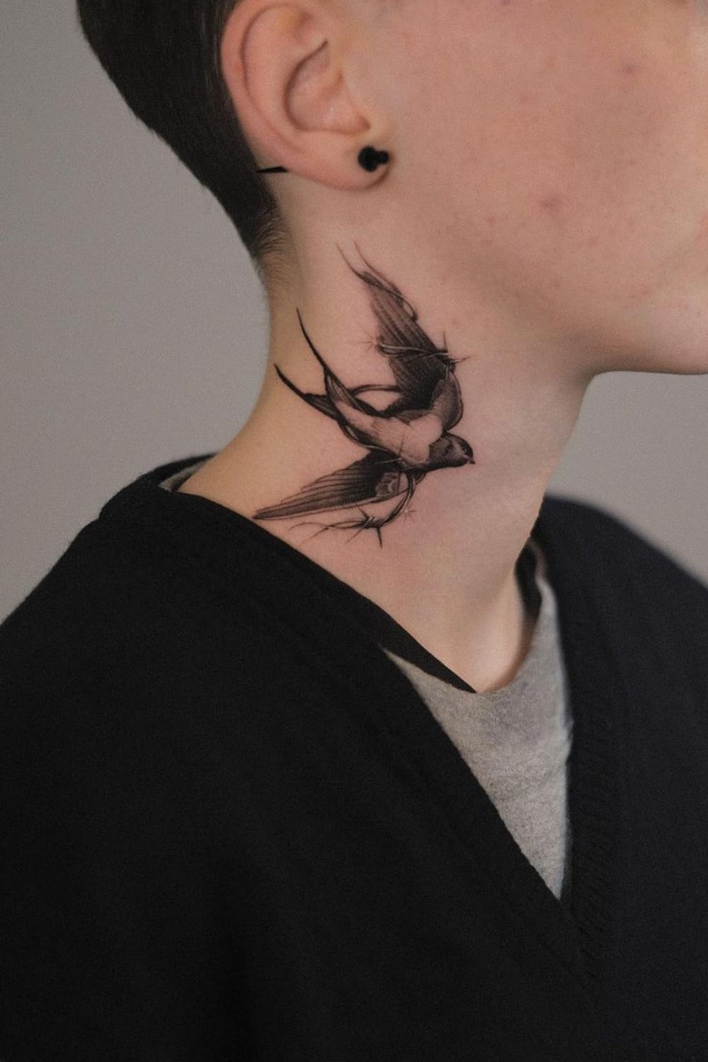 Swallow Tattoo on the Neck