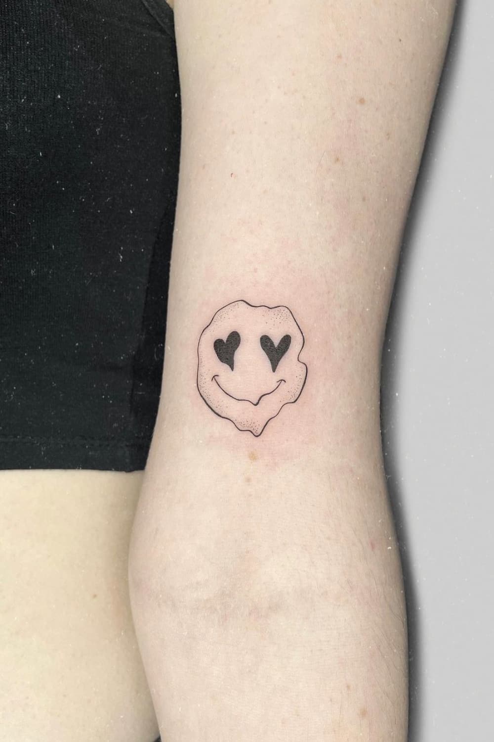 Unique Smiley Face Tattoo