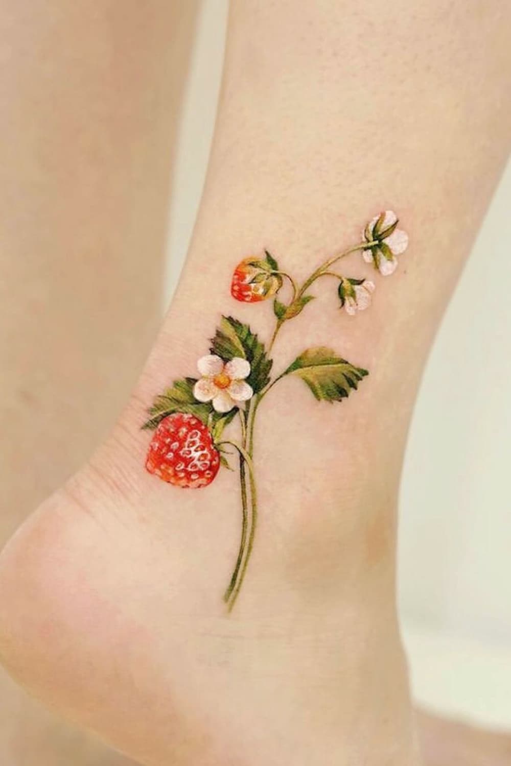 Strawberry tattoo on the ankle