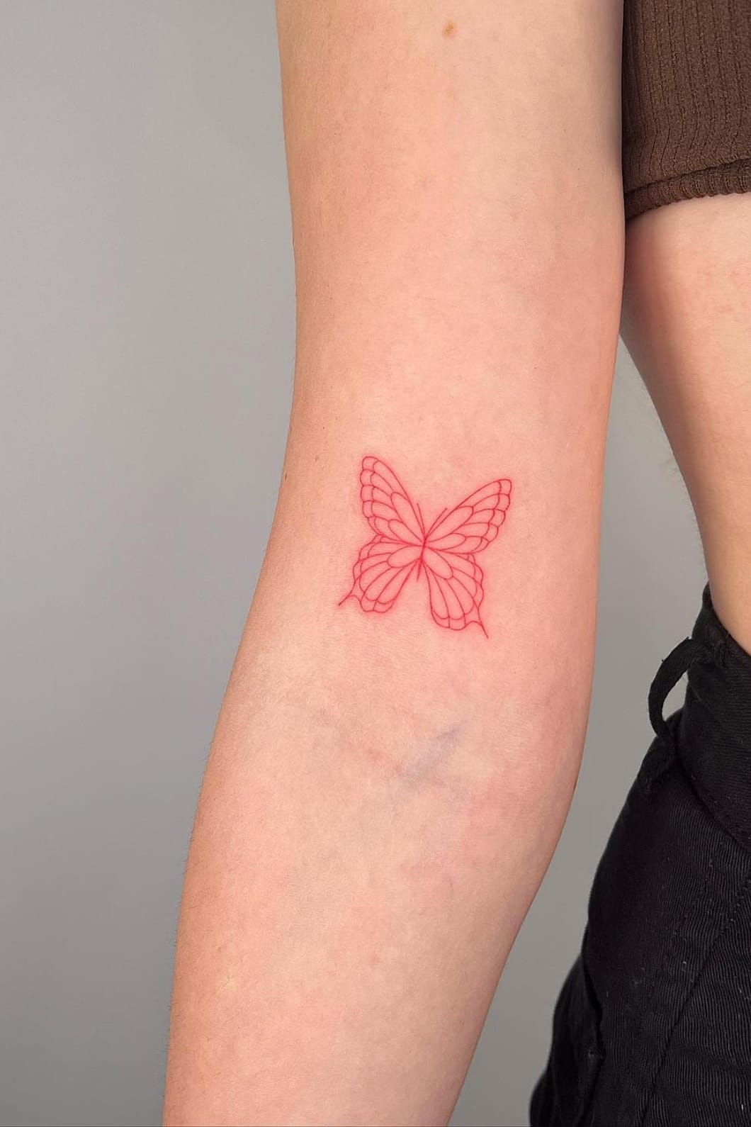 Minimalist Red Butterfly Tattoo