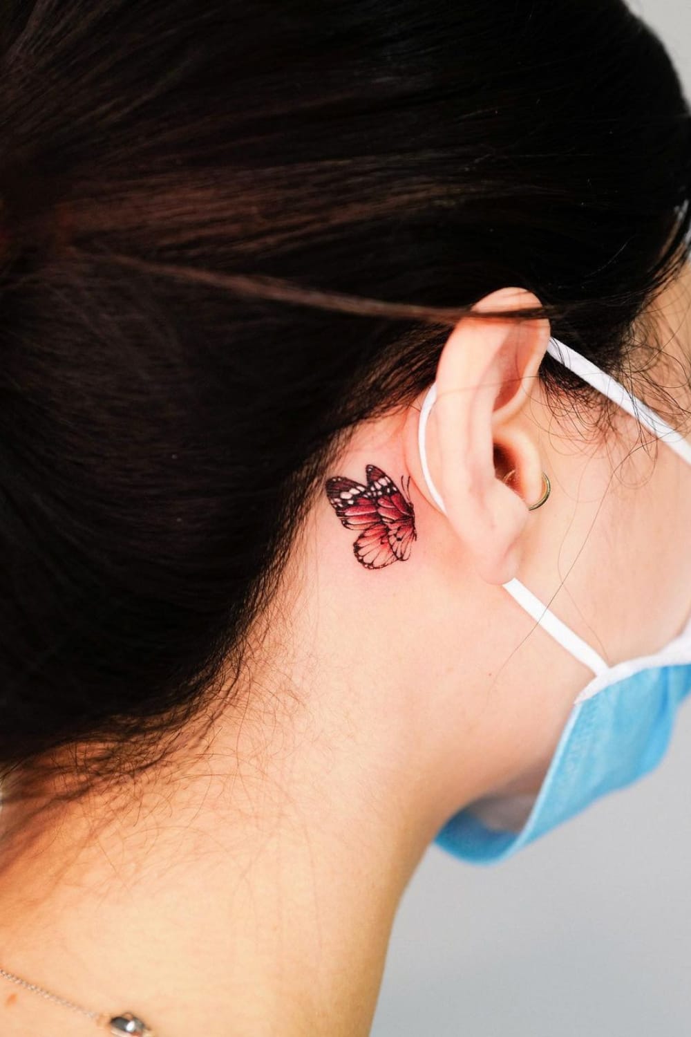 Red Butterfly Tattoo Behind the Ear